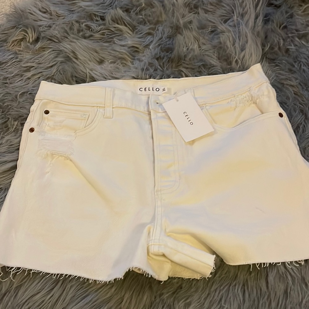 Distressed cream shorts